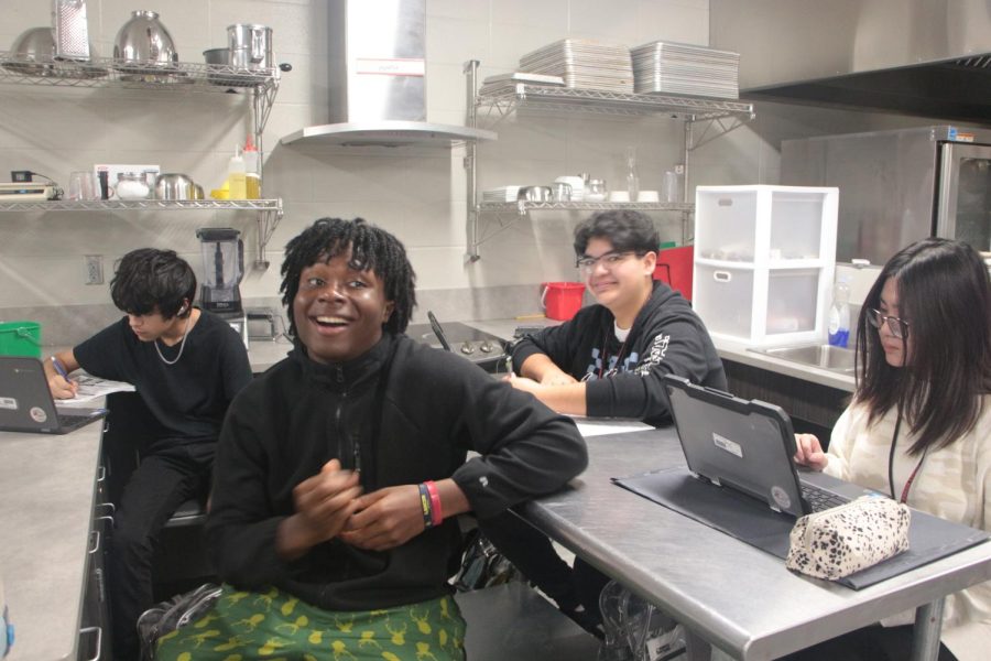 Culinary students relax after planning their next recipe.