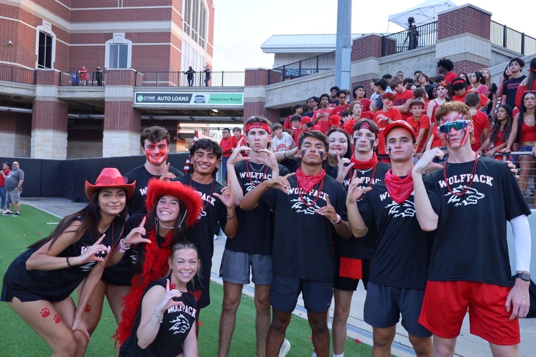 Wolfpack leading the student section during the Jersey Village vs Langham Creek game 