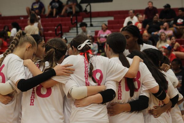 Varsity Volleyball girls playing in support of Breast Cancer at Cy Springs High School. Both times the Lobos faced the Panthers, the Lobos won 3-0.