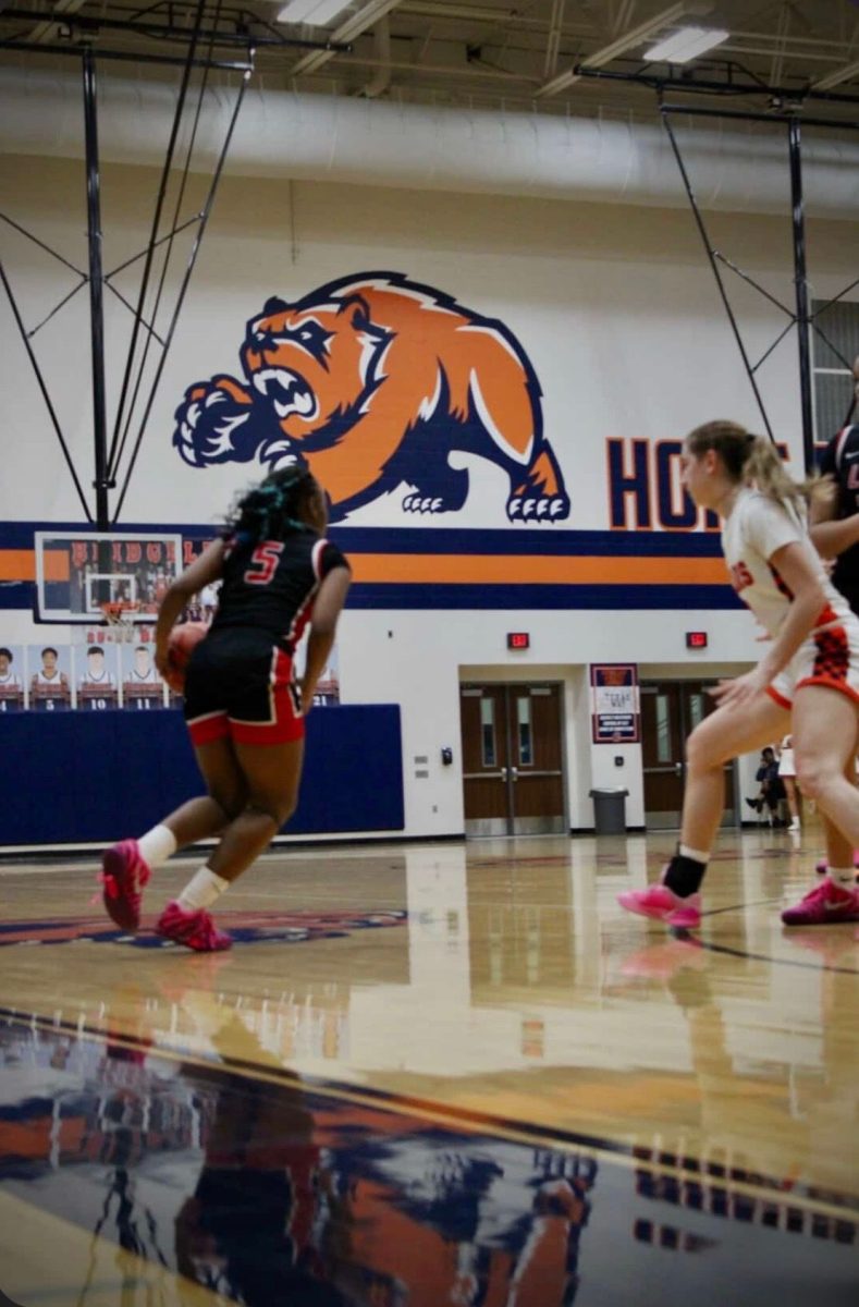 Zamari Aitken #5 dribbles the ball, looking for what play to make next. Photo courtesy of Zamari Aitken.