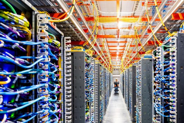 A technician works at an Amazon Web Services AI data center in New Carlisle, Indiana, U.S., October 2, 2025. REUTERS/Noah Berger for AWS
